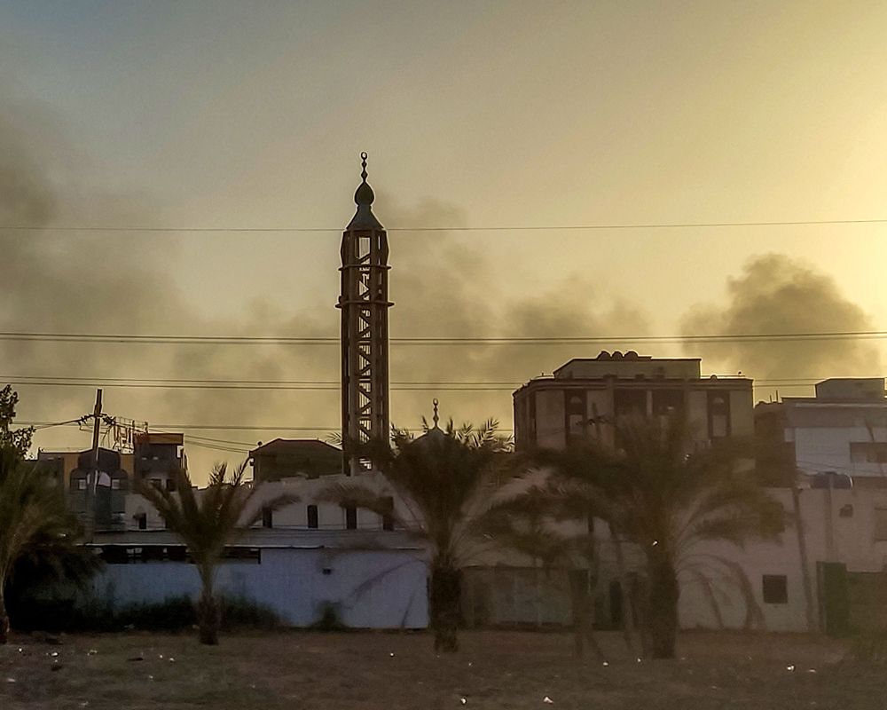 Smoke rises above buildings in Khartoum